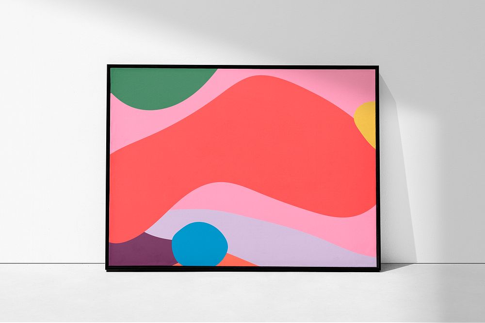 Pink abstract artwork framed on a wall