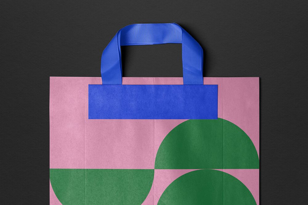 Paper shopping bag in pink and green