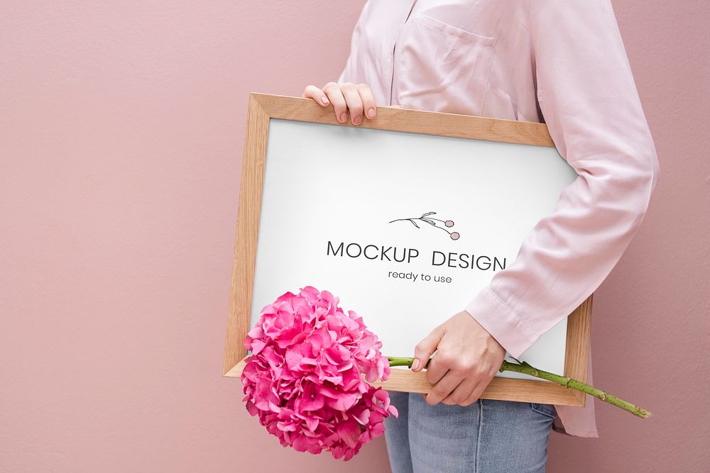 Girl holding a frame mockup with pink hydrangeas