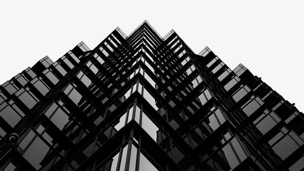 The edges of a wavy skyscraper facade in black and white image element 