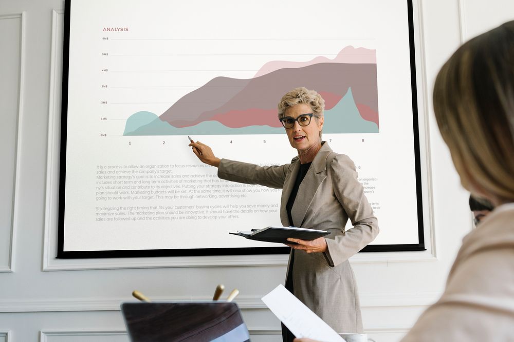 Senior businesswoman presenting in a meeting