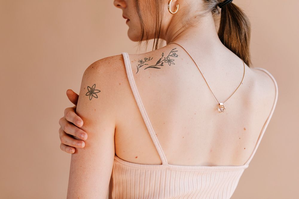 Floral tattoos on woman's shoulder