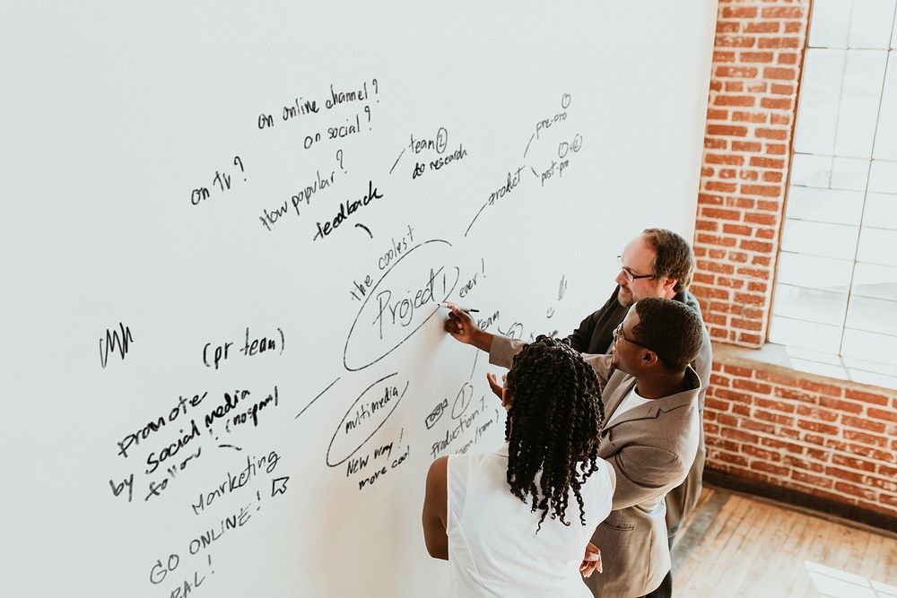 Diverse business people brainstorming at work