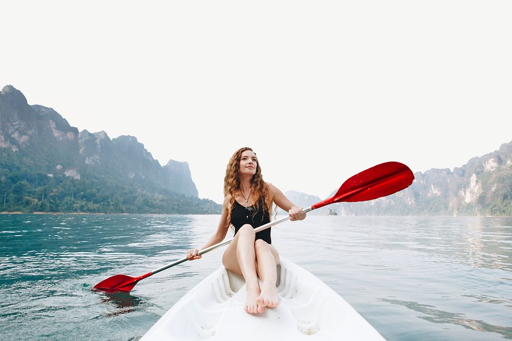 Woman paddling a canoe through a national park collage element psd