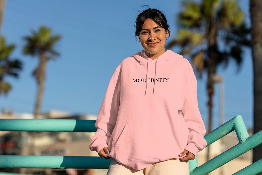 Customizable streetwear mockup, psd hoodie on a confident Latina woman