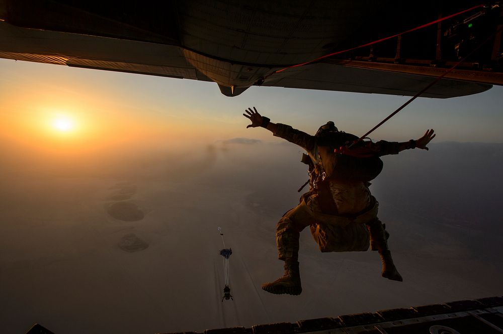 A U.S. Air Force pararescueman assigned to the 82nd Expeditionary Rescue Squadron jumps from an Air Force HC-130P/N King…