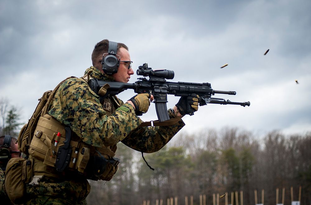 U.S. Marine Sgt. Travis Riggs with the Marine Security Augmentation Unit (MSAU), engages his target during a weapons field…