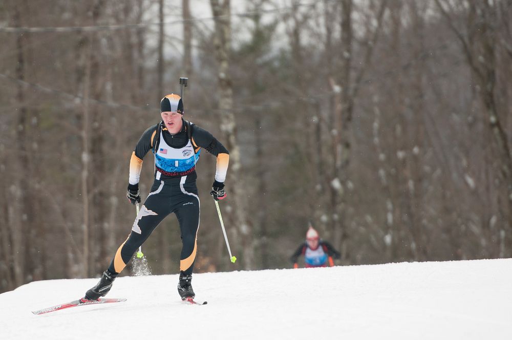 U.S. Army Pvt. Warren Rosholt, with the Minnesota Army National Guard, competes in the junior men's sprint biathlon race as…