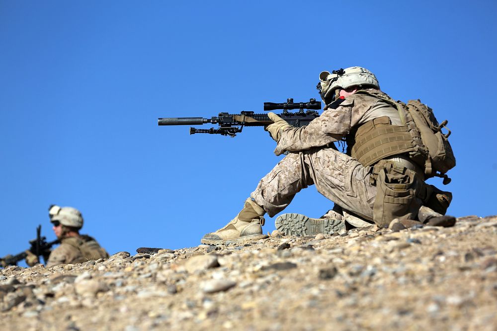 U.S. Marines with Charlie Company, 1st Battalion, 9th Marine Regiment provide security during a patrol near Patrol Base…