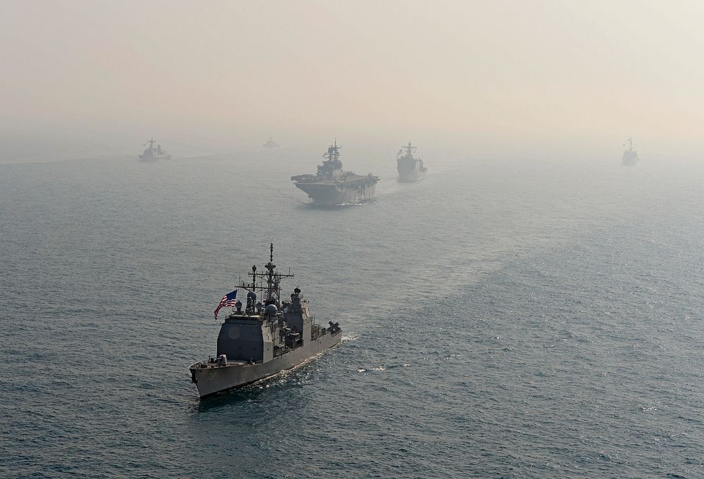 The guided missile cruiser USS Lake Erie (CG 70), front, transits the East China Sea with ships assigned to the Bonhomme…