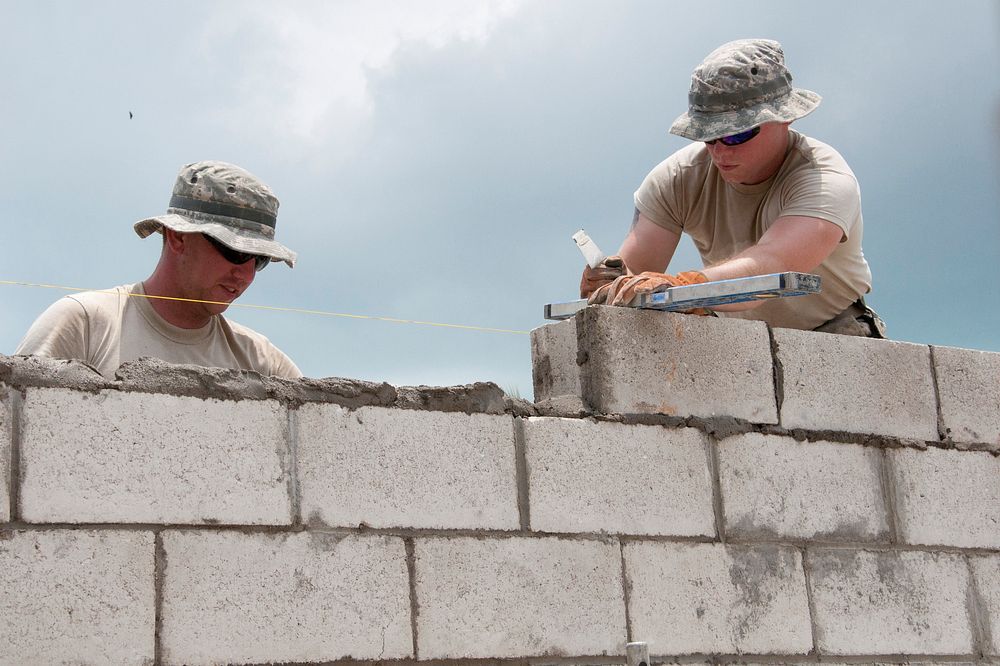 U.S. Army Sgt. Jason Cowan, left, and Spc. Christopher Moses, both engineers with the 1023rd Vertical Engineer Company…