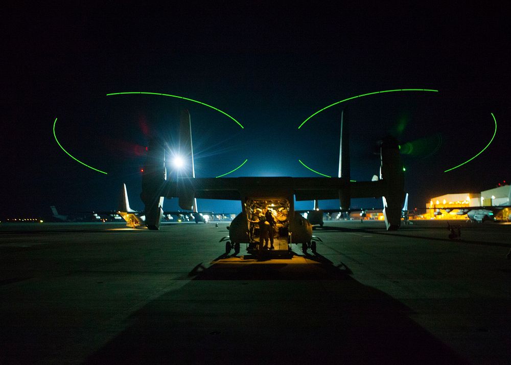 Crew members conduct final inspections on a U.S. Marine Corps MV-22B Osprey tiltrotor aircraft assigned to Special Purpose…