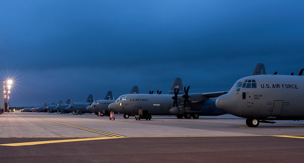 U.S. Air Force C-130 Hercules aircraft assigned to the Air National Guard and the 37th Airlift Squadron sit on the flight…
