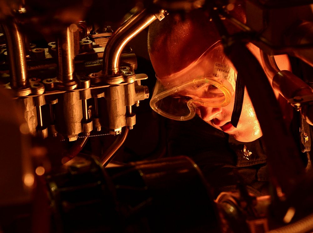 U.S. Navy Gas Turbine System Technician (Mechanical) 3rd Class Dallas Hulsey performs routine maintenance on an engine…