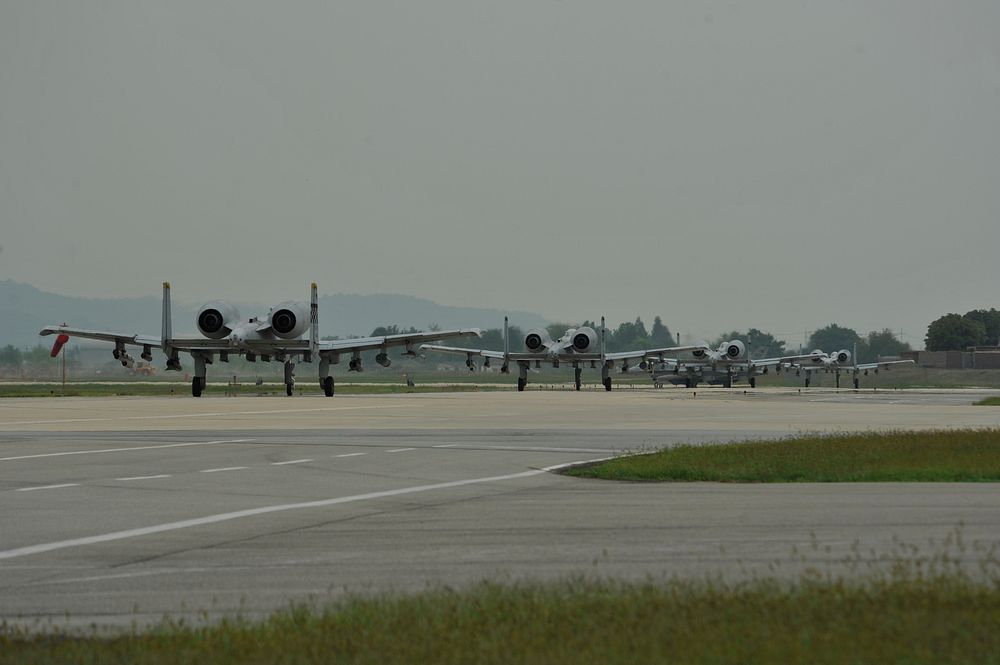 Four U.S. Air Force A-10 Thunderbolt II aircraft assigned to the 25th Fighter Squadron taxi down the runway at Osan Air Base…