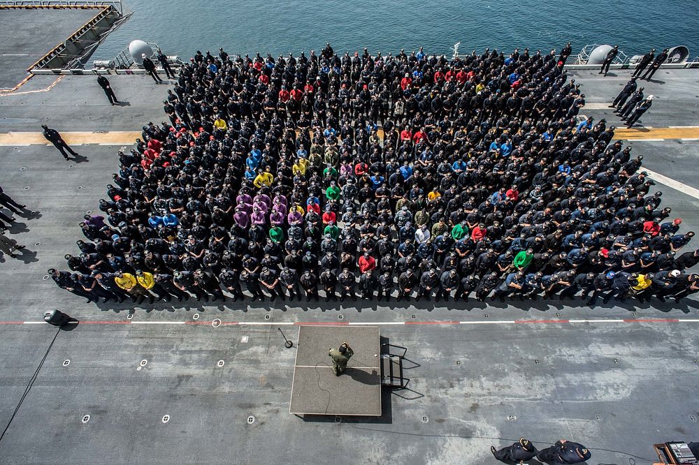 Capt. Joey Tynch, commanding officer of the forward-deployed amphibious assault ship USS Bonhomme Richard (LHD 6), addresses…