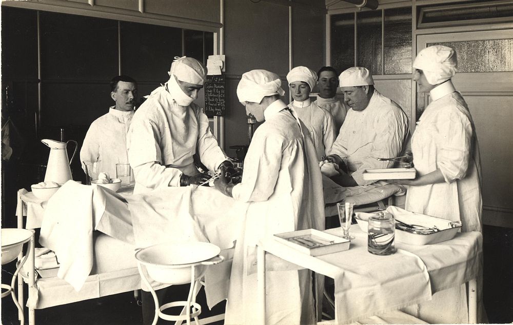 King George Military Hospital, 4th floor theatre group, Dr. Murrison operating (1915). Original public domain image from…