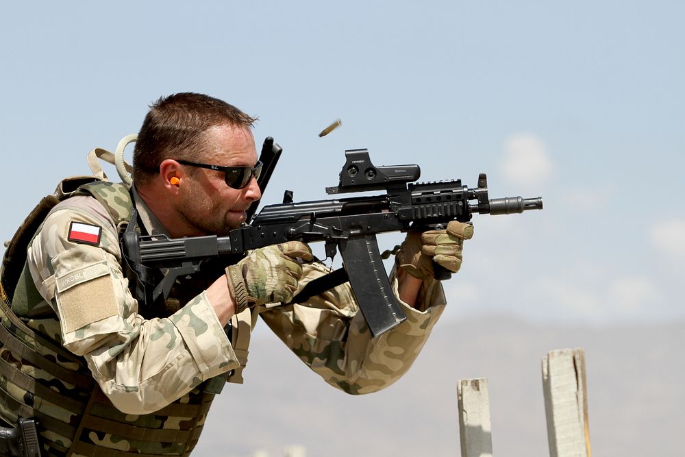 A Task Force White Eagle service member participates in a live fire range June 5, 2015 at Tactical Base Gamberi in eastern…