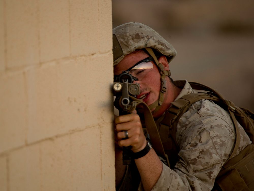 U.S. Navy, HN Grady Seibert with 2nd Battalion, 7th Marine Regiment, 1st Marine Division, posts security during a Heavy Huey…