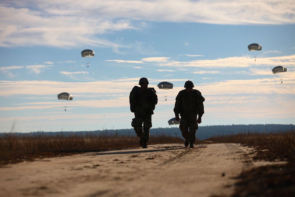 U.S. paratroopers return after completing their jumps in participation for the 18th Annual Randy Oler Memorial Operation Toy…