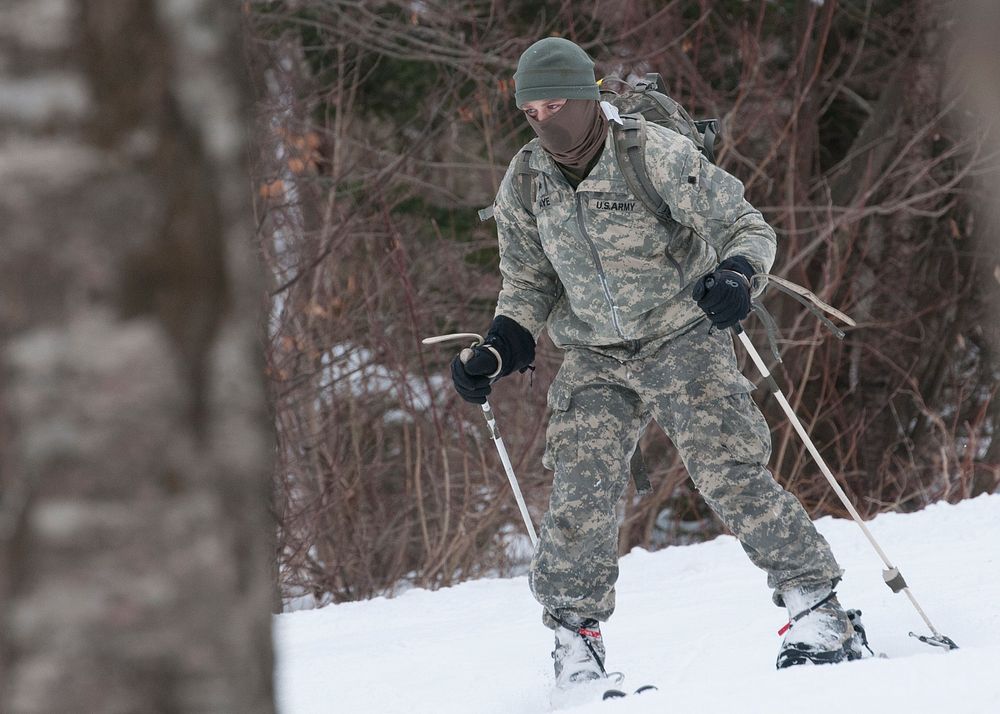 A Company, 3rd Battalion, 172nd Infantry Regiment (Mountain) Soldiers ski down the mountain during training at Bolton Valley…