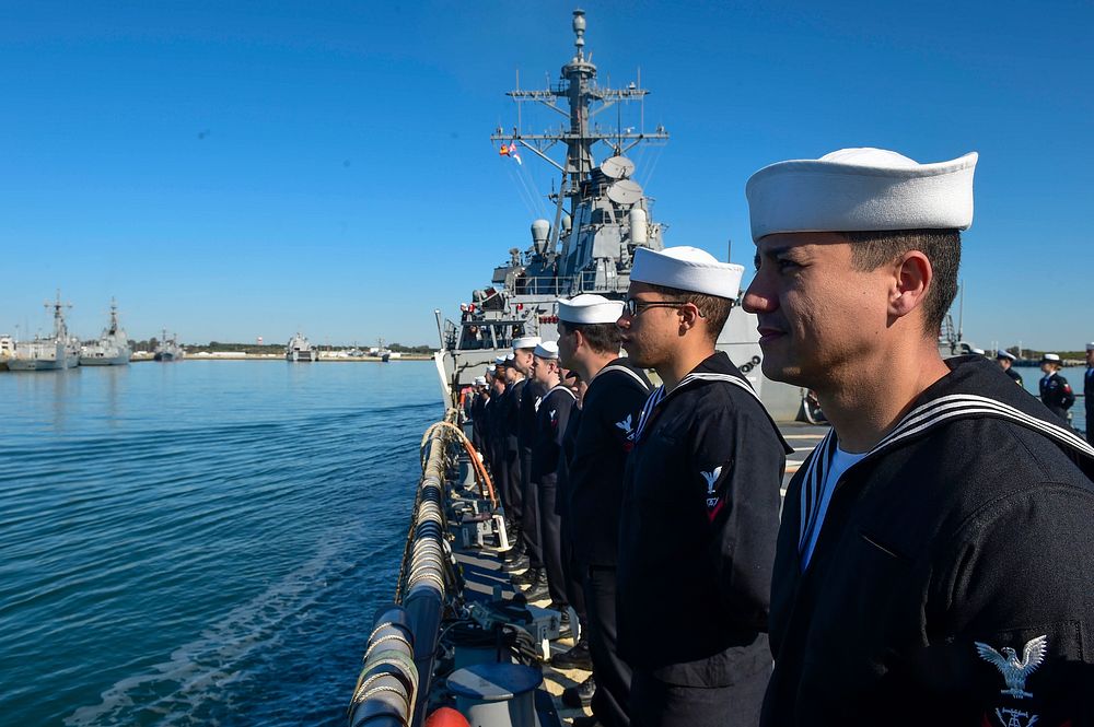 U.S. Sailors man the rails as USS Carney (DDG 64) pulls into Rota, Spain, March 13, 2016.