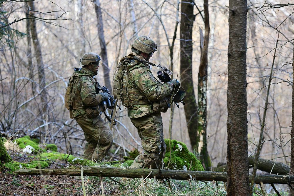 U.S. Army paratroopers assigned to 2nd Battalion, 503rd Infantry Regiment, 173rd Airborne Brigade, move through the woods of…