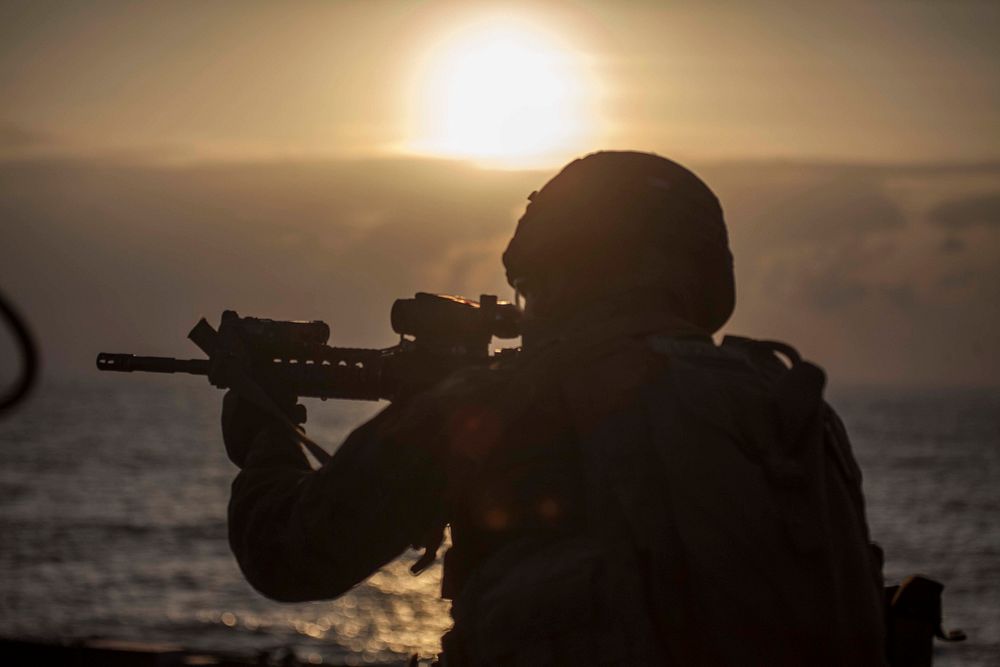 A Marine with Battalion Landing Team 1st Battalion, 5th Marines, 31st Marine Expeditionary Unit, fires at his target during…