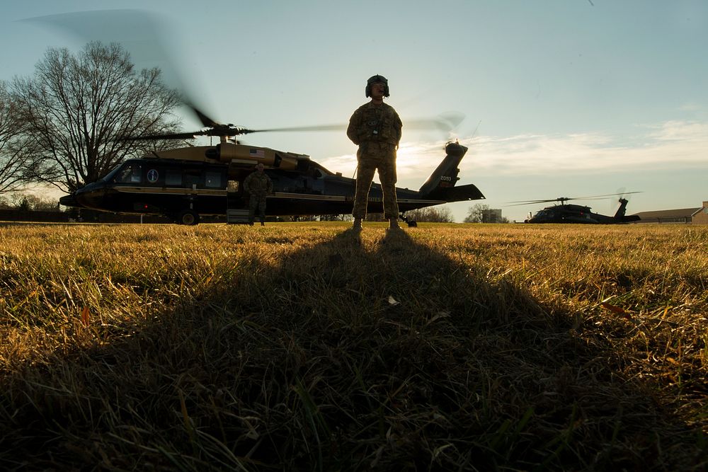 A U.S. Army aircrewman awaits the arrival of Marine Corps Gen. Joe Dunford, the chairman of the Joint Chiefs of Staff…
