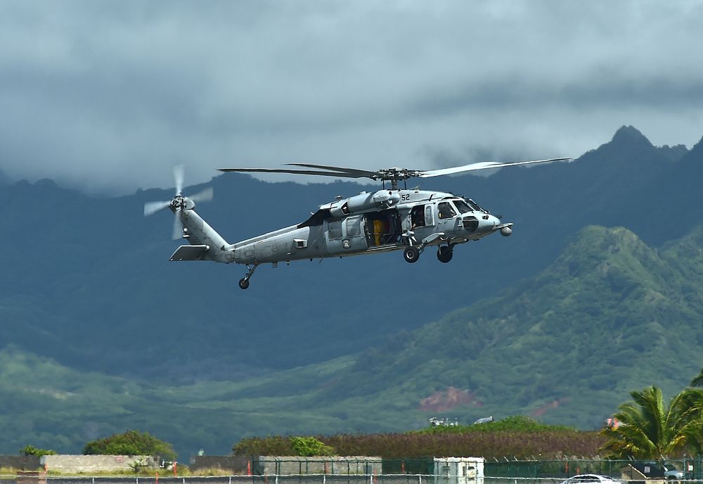 A U.S. Navy SH-60 Seahawk helicopter transports Royal New Zealand Commodore Jim Gilmour during an amphibious demonstration…