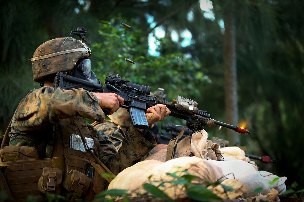 U.S. Marine Corps infantry squad leaders assigned to School of Infantry West, Detachment Hawaii, defend their position…