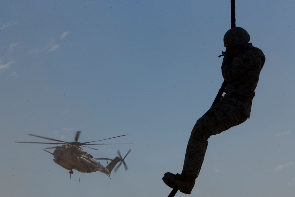 U.S. Marines with 2nd Battalion, 3rd Marine Regiment, 3rd Marine Division conduct a fast rope exercise out of a CH-53E Super…