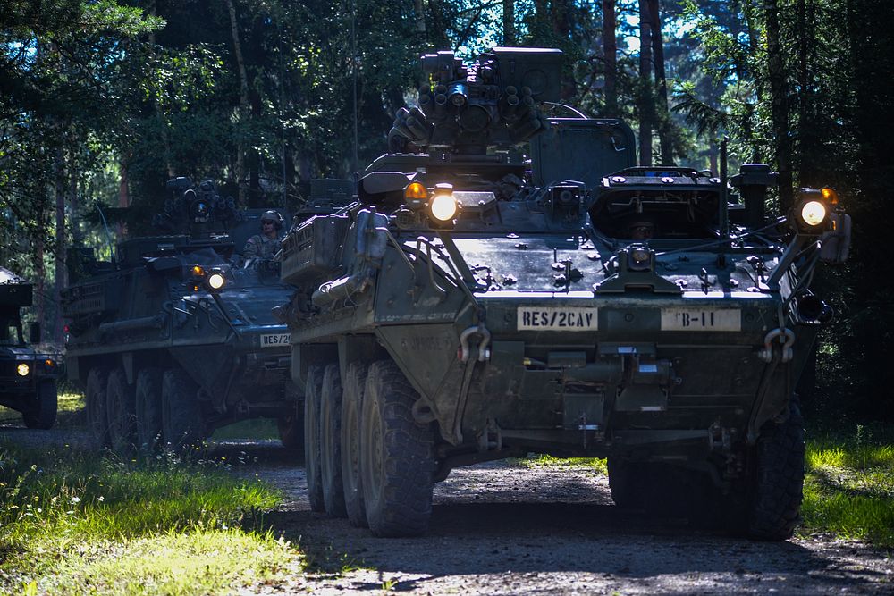 U.S. Soldiers, assigned to the Regimental Engineer Squadron, 2nd Cavalry Regiment, move their Stryker vehicles towards to…