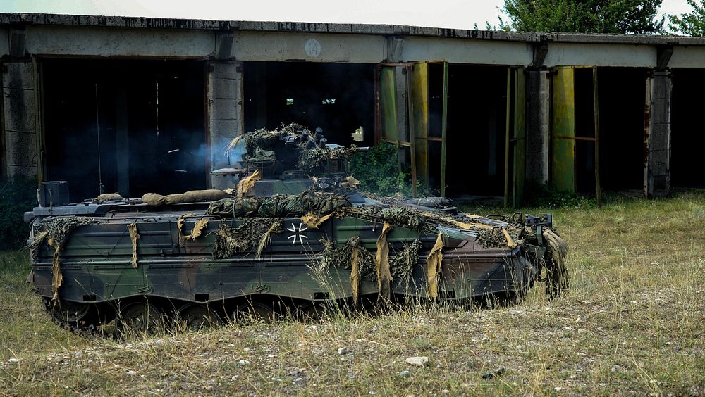 A German army Marder infantry fighting vehicle with the 391st Mechanized Infantry Battalion lays suppressive fire at Vaziani…