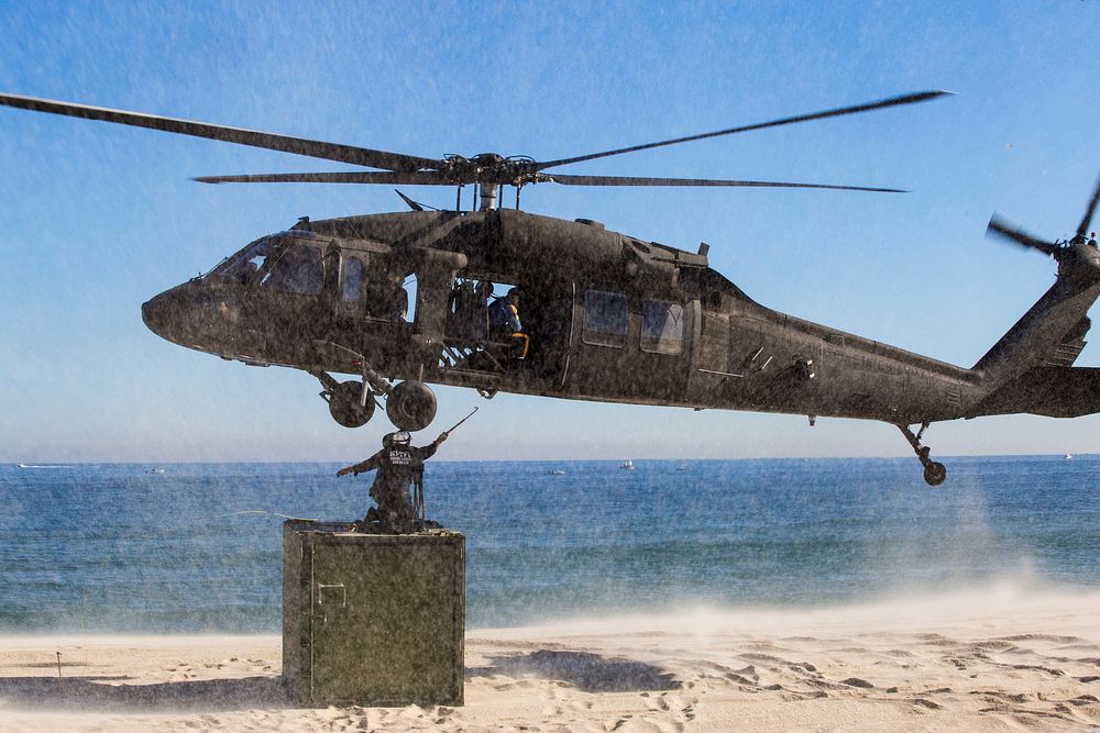 New Jersey State Police sling load cargo on to a UH-60 Black Hawk with the 1-150th Assault Helicopter Battalion, New Jersey…