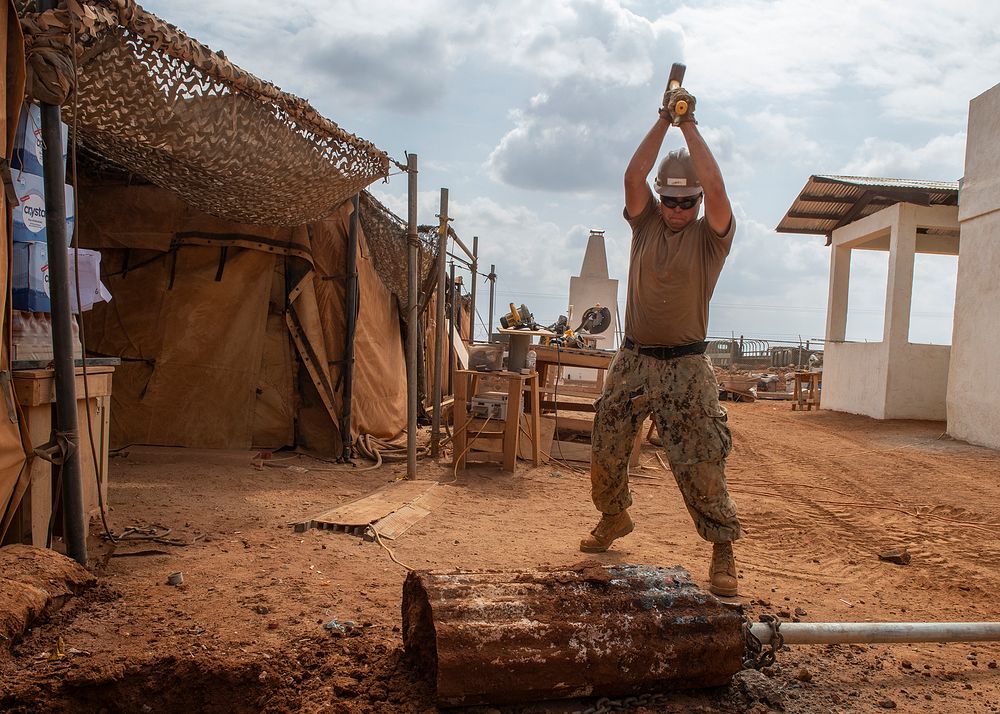 U.S. Navy Seaman Tyler Hill, a Seabee assigned to Naval Mobile Construction Battalion 1, Combined Joint Task Force-Horn of…