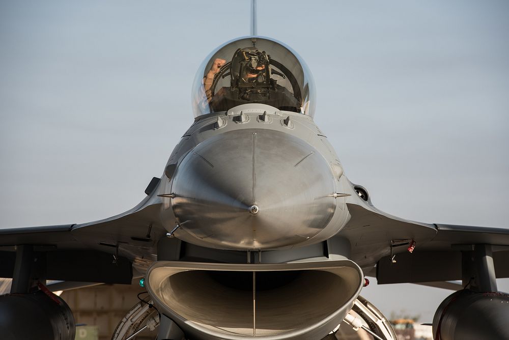 An F-16 Fighting Falcon pilot assigned to the 134th Expeditionary Fighter Squadron performs preflight checks at the 407th…