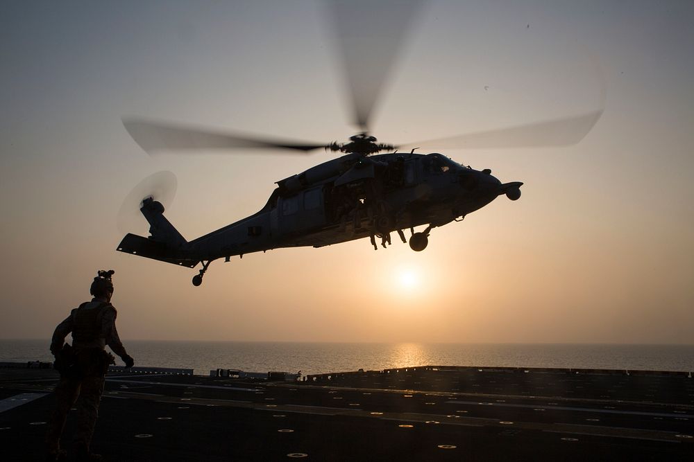 A U.S. Navy SH-60 Sea Hawk helicopter carrying Maritime Raid Force (MRF) Marines with the 24th Marine Expeditionary Unit…