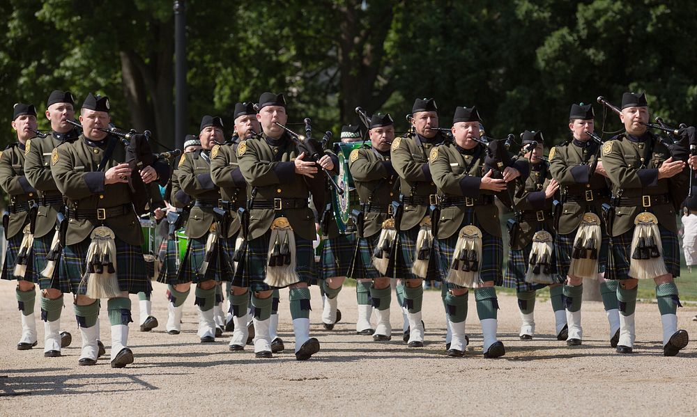 Members of the U.S. Border Patrol Pipes and Drums march in formation while competing in the Steve Young Honor Guard Pipes…