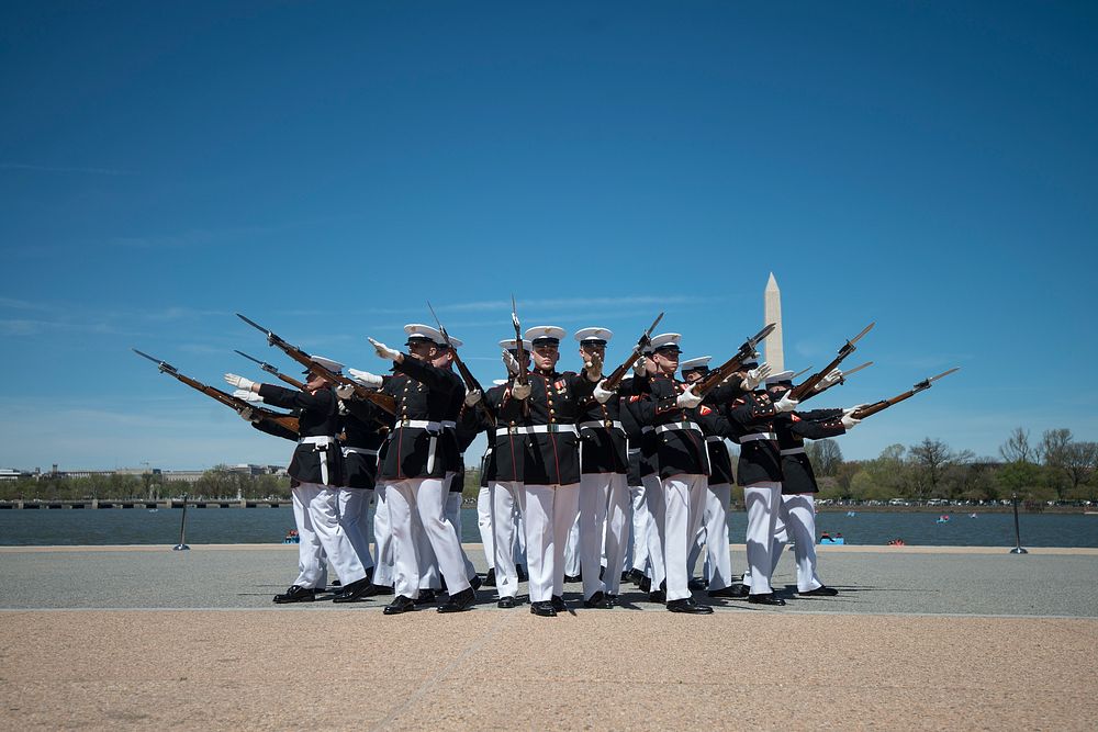 The U.S. Marine Corps Silent Drill Platoon competes during the Joint Service Drill Team Exhibition at the Jefferson Memorial…