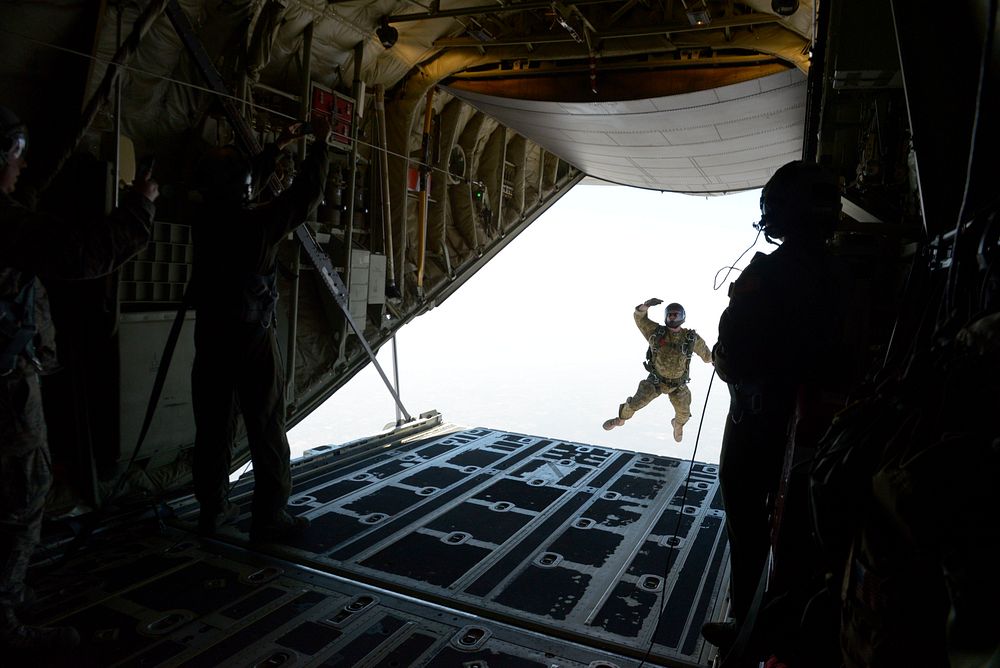 A U.S. Air Force combat controller from the 353rd Special Operations Group, Kadena Air Base, Japan exits a C-130J Super…