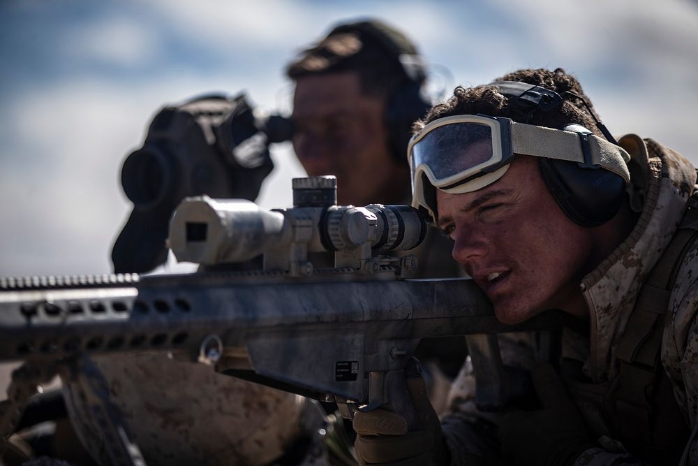 U.S. Marine Corps Lance Cpl. Bryce Hopkins and Cpl. Ricardo Perez, both scout snipers with the 3rd Battalion, 3rd Marine…
