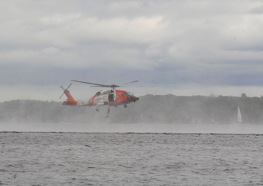 A U.S. Coast Guard rescue swimmer is dropped into Grand Traverse Bay during a rescue demonstration at the National Cherry…