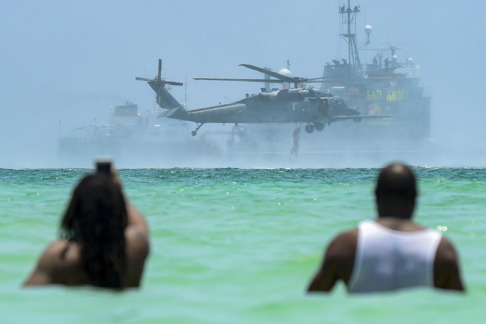 Spectators view an aerial demonstration during the National Salute to America’s Heroes Air and Sea Show, May 28, 2017, at…