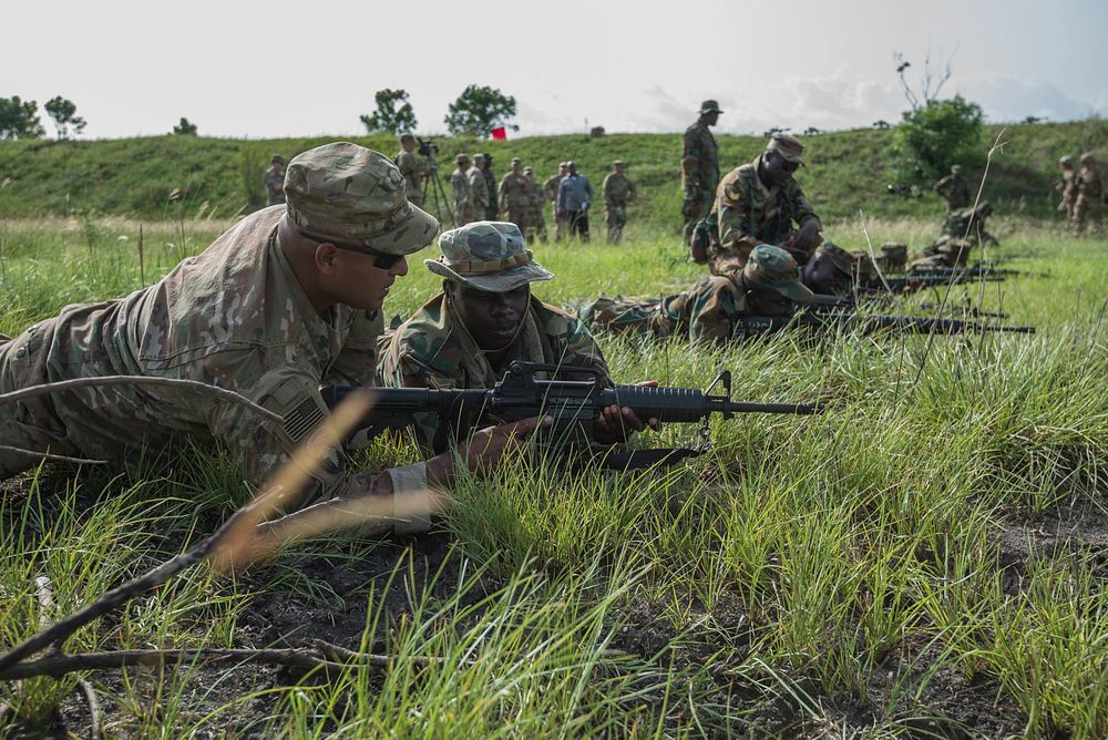 Ghana Armed Forces and U.S. Soldiers practice basic rifle marksmanship skills at the field training exercise during United…
