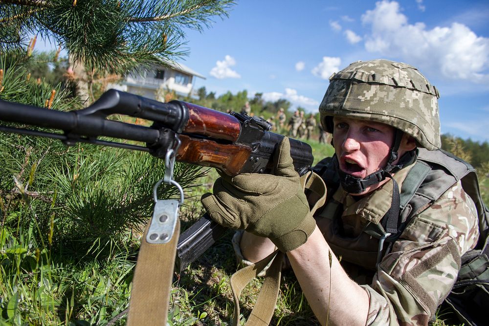 A Ukrainian soldier with the 1st Airmobile Battalion, 79th Air Assault Brigade calls out to a fellow soldier, letting the…