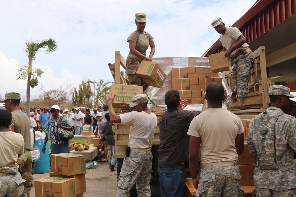 U.S. Soldiers with the Virgin Islands National Guard and the Virgin Islands Fire Department distributes food and water to…
