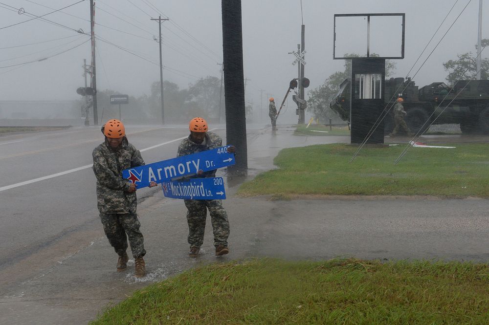 U.S. Soldiers with the 386th Engineer Battalion, Texas Army National Guard, pick up large debris in the wake of Hurricane…