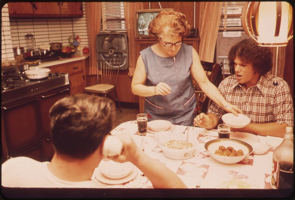 The Anthony Brunos at Dinner in Their Well-Kept Home at 39 Neptune Road. Original public domain image from Flickr