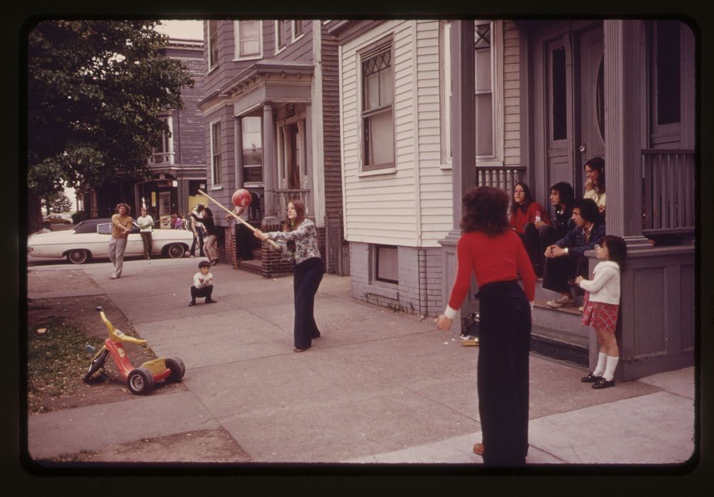 Children Play Ball in Front of Their Homes on Neptune Road Logan Airport Is at the End of the Street. Original public domain…